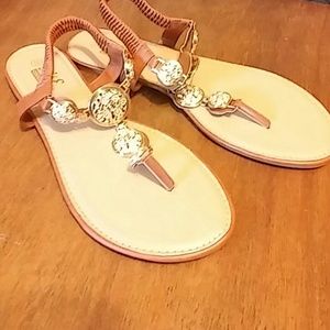 Gold medallion flip flops